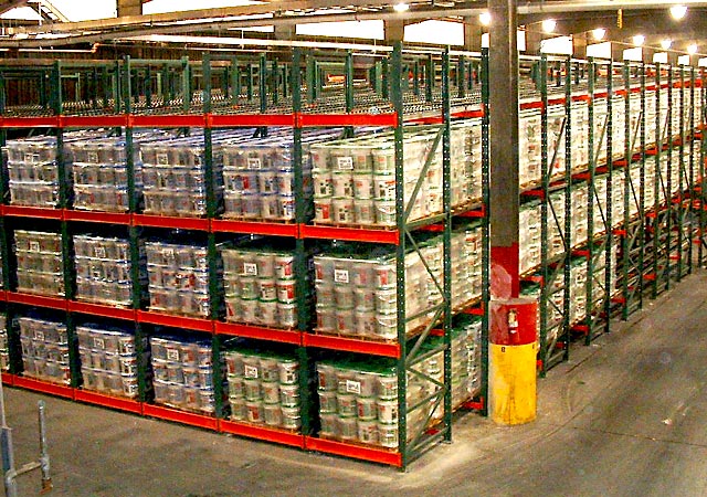 Flow racking system loaded with pallets at the pick face